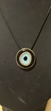 Evil Eye pendant on an adjustable leather band