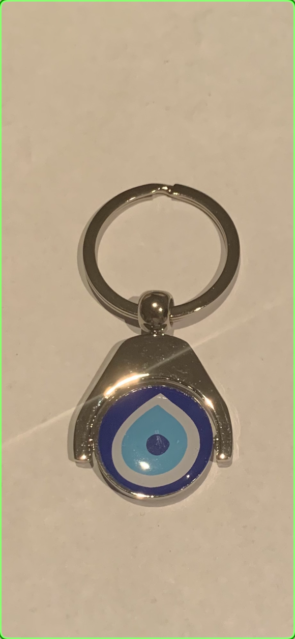 Key ring with rotating evil eye