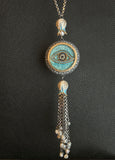 Designer Evil Eye tassel necklace.